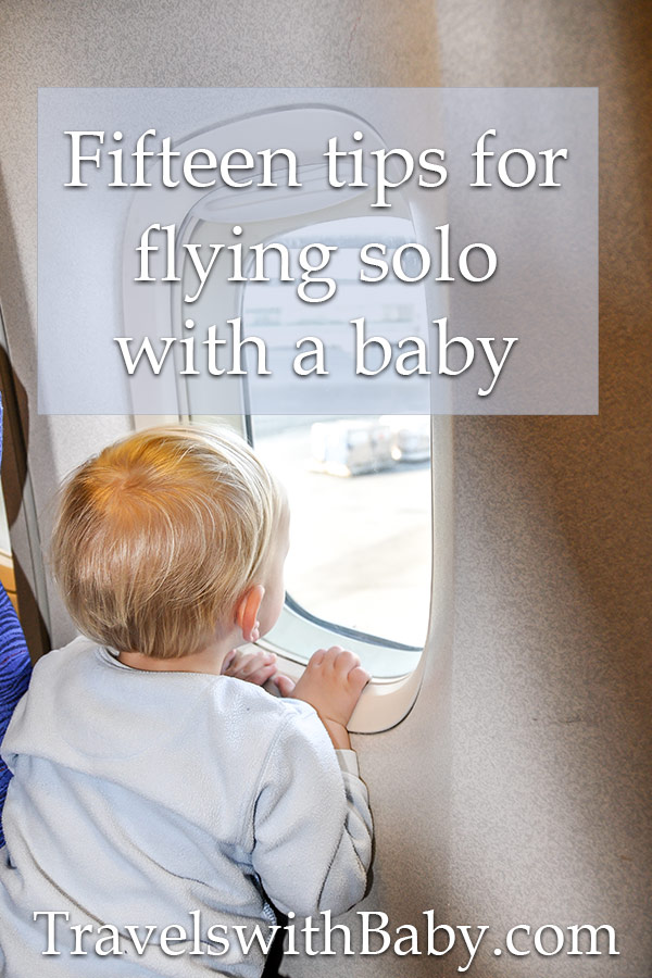 baby on airplane looking out window